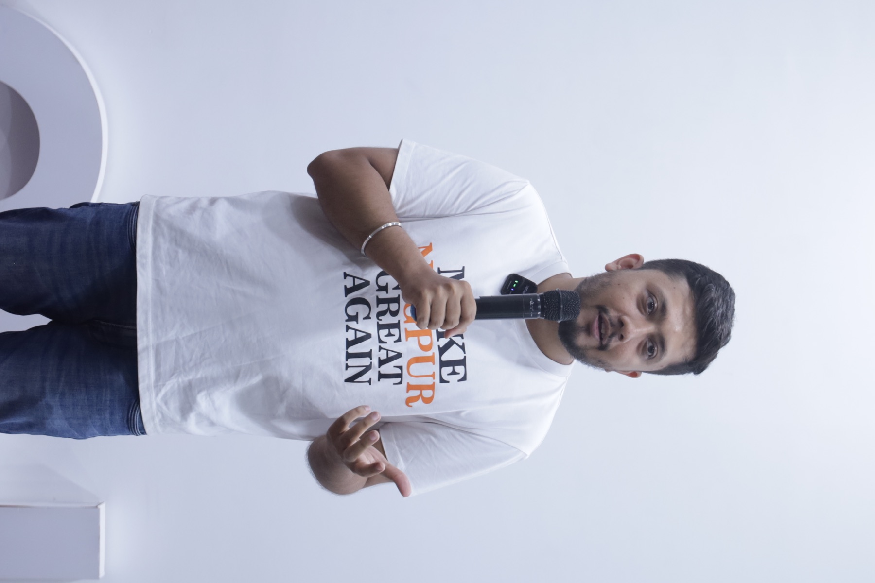Speaker sharing an idea on stage